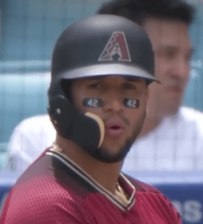 Celebrating Jackie Robinson Day, Puig makes a friend and a Padre