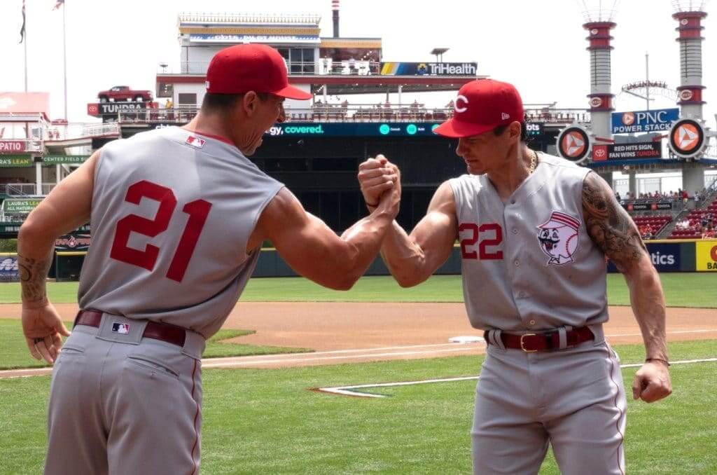 Reds play in sleeveless throwback uniforms against St. Louis Cardinals