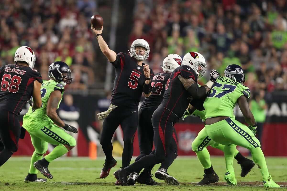 Cleats and socks from the Seattle Seahawks color rush uniform are