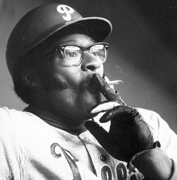 Dick Allen juggling and smoking a cigarette. This picture was used