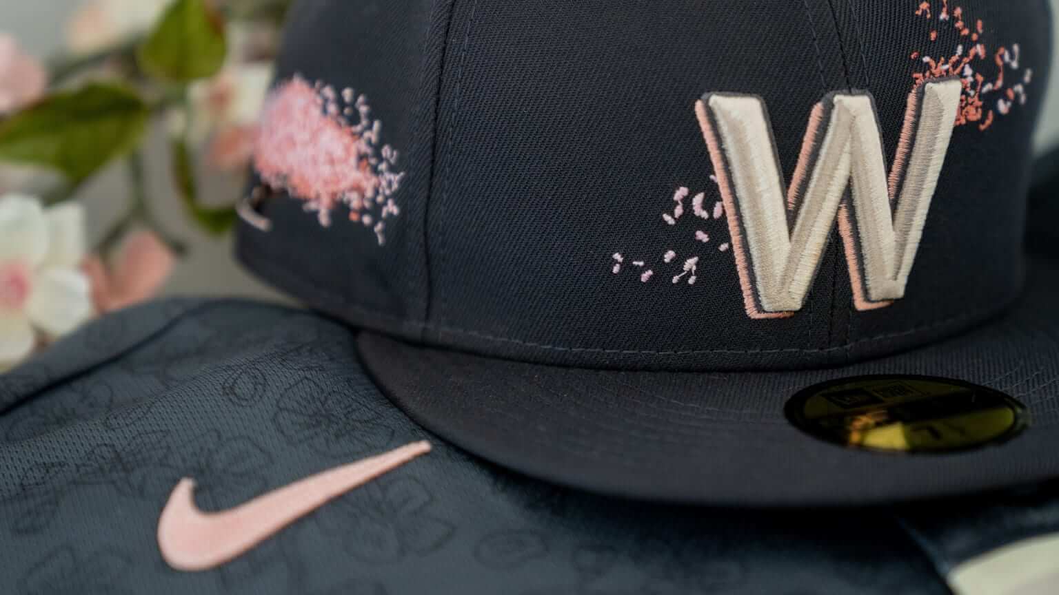 Real men wear pink'  Nats fans line up to buy cherry blossom uniforms 