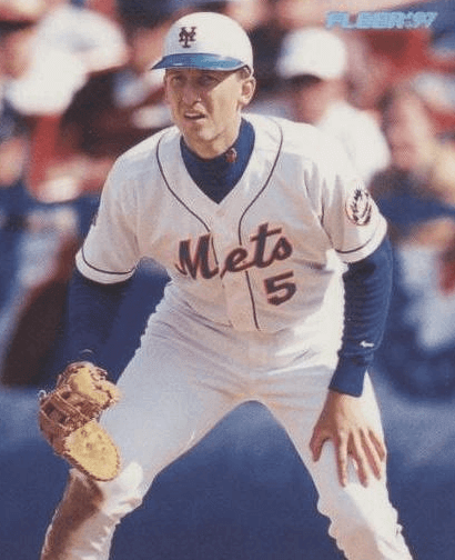 John Olerud attempts to be a pitcher, helmet and all.